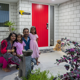 Classic Builders clients family photo in front of their new build home