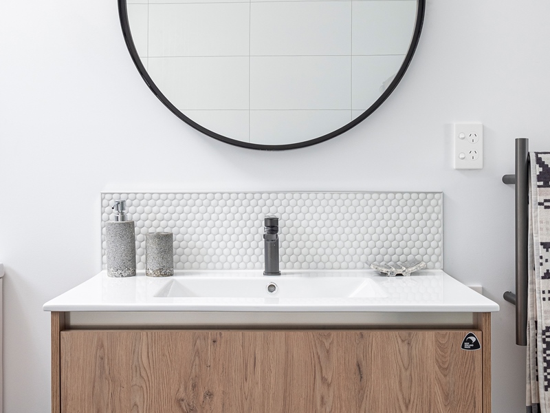 Modern bathroom vanity with circle mirror