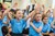 Kids in school raising their hands.