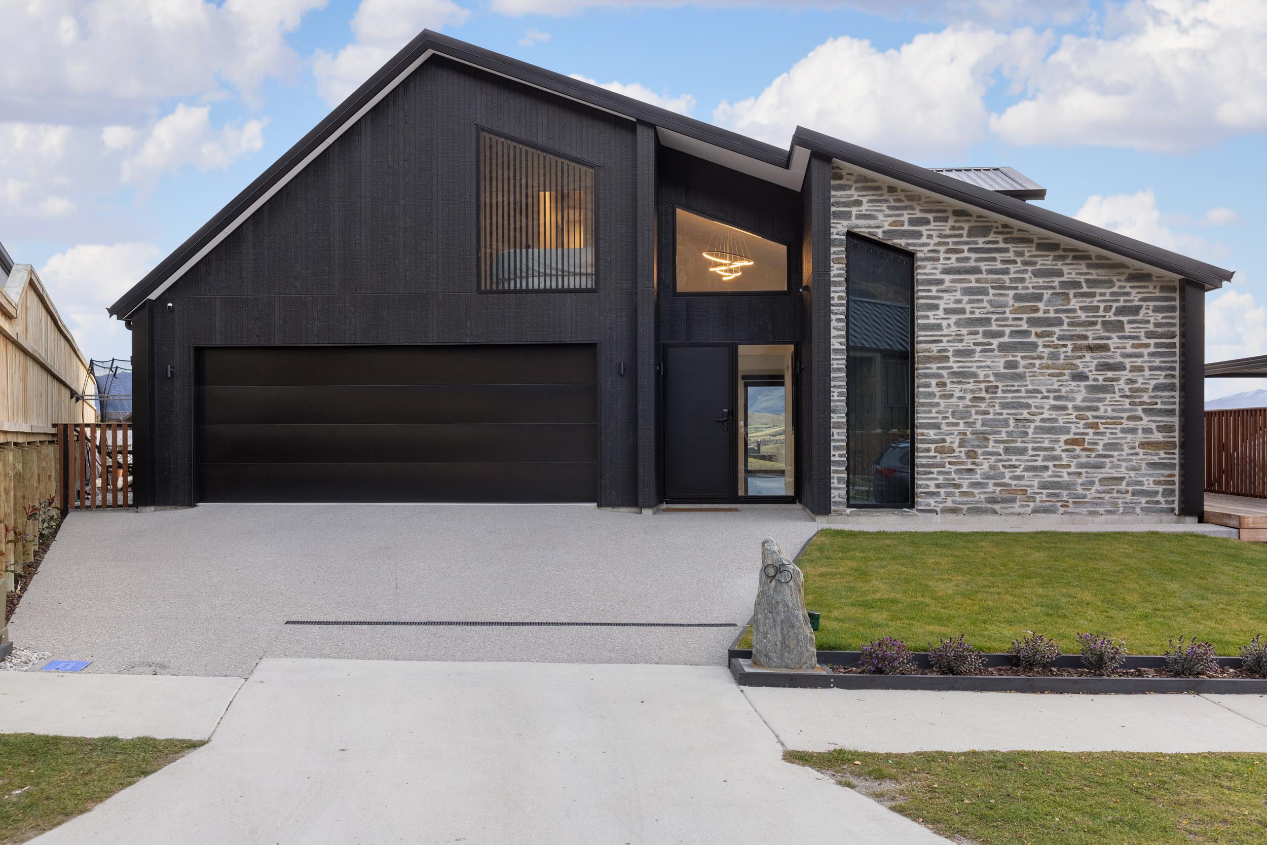 Modern Home with Dark, Striking Architectural Facade | Classic Builders