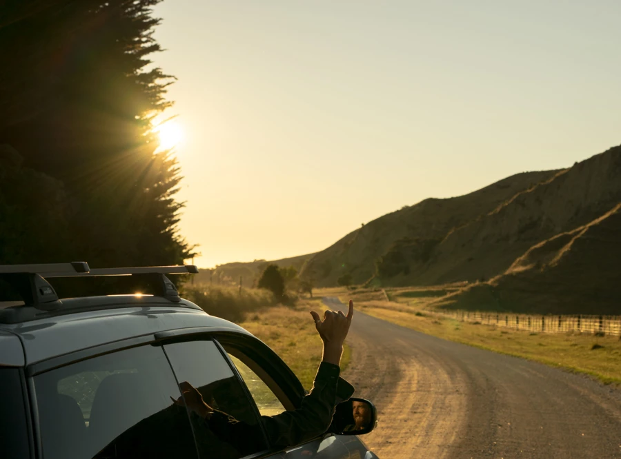 man driving from Hunua Views to the beach